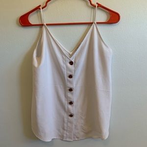 Loft tank with tortoise shell buttons
